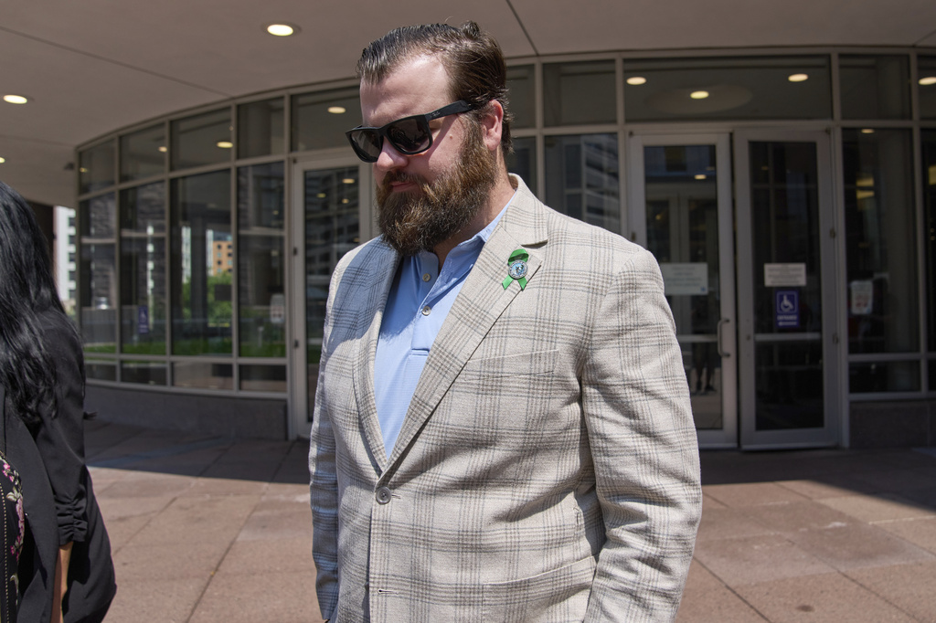 Colin Hortman, son of Melissa and Mark Hortman, leaves after attending the initial state court appearance for Vance Boelter, Monday, Aug. 3, 2026, in Minneapolis. (AP Photo/Ellen Schmidt)