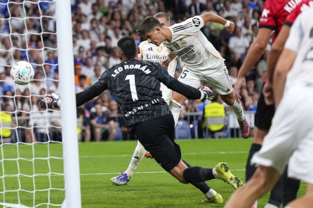 Real Madrid's Arda Guler scores his side's first goal during the Spanish La Liga soccer match between Real Madrid and Mallorca in Madrid, Saturday, Aug. 30, 2025. (AP Photo/Manu Fernandez)