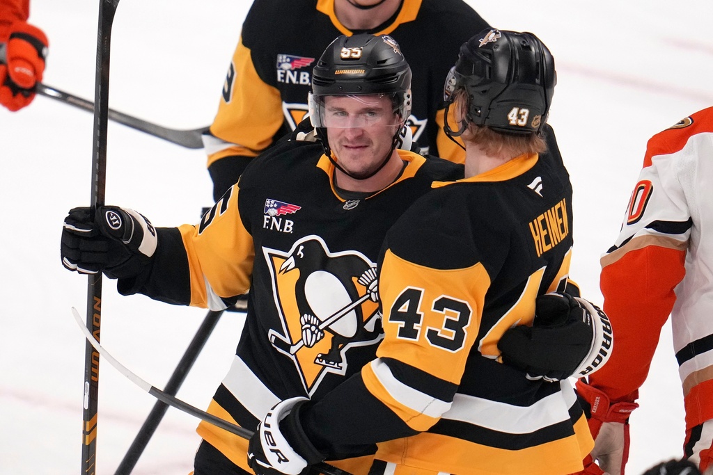 Pittsburgh Penguins' Noel Acciari (55) celebrates his goal during the first period of an NHL hockey game against the Anaheim Ducks in Pittsburgh, Tuesday, Dec. 9, 2025. (AP Photo/Gene J. Puskar)