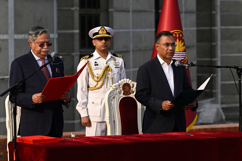 Tarique Rahman, Chairperson of the Bangladesh Nationalist Party, takes oath as Prime Minister of Bangladesh from President Mohammed Shahabuddin, left, at the National Parliament in Dhaka, Bangladesh, Tuesday, Feb.17, 2026. (AP Photo/Mahmud Hossain Opu)
