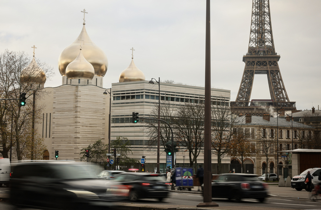 The Holy-Trinity Russian orthodox Cathedral and the adjoining culture center, right, are seen next to the Eiffel Tower in Paris, Wednesday, Nov. 26, 2025. (AP Photo/Thomas Padilla)