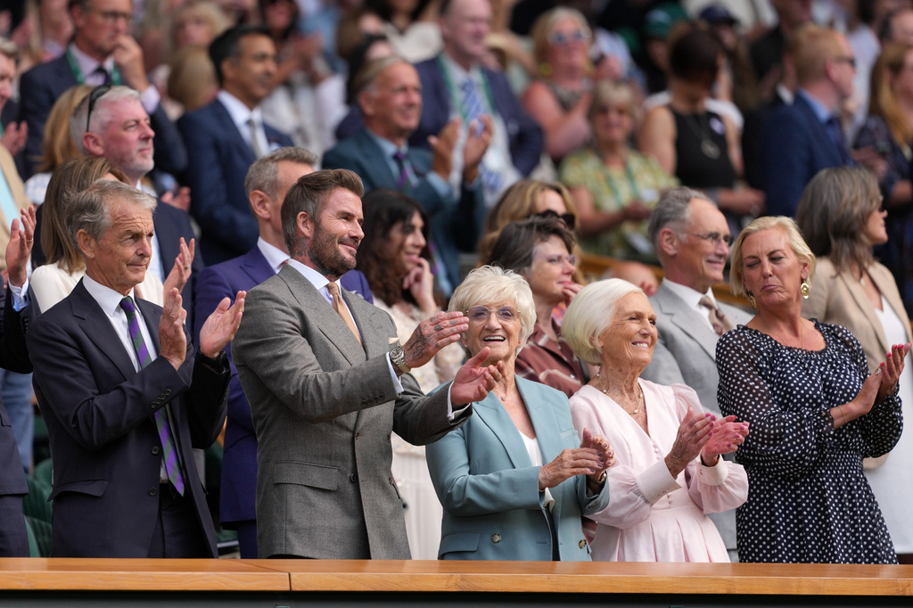 Soccer legend David Beckham and his mother Sandra Georgina Beckham applaud after the men's singles match between Jannik Sinner of Italy and Miomir Kecmanovic of Serbia at the Wimbledon Tennis Championships in London, Monday, June 29, 2026.((AP Photo/Kin Cheung)