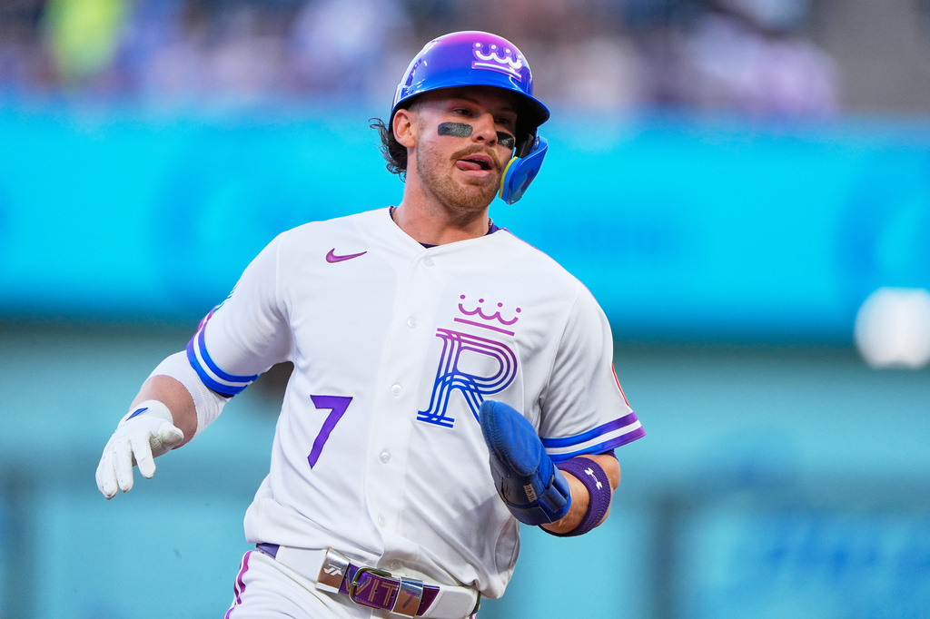 Kansas City Royals' Bobby Witt Jr. runs to third on a fly out hit by Salvador Perez during the fourth inning of a baseball game against the Los Angeles Angels, Friday, April 24, 2026, in Kansas City, Mo. (AP Photo/Charlie Riedel)
