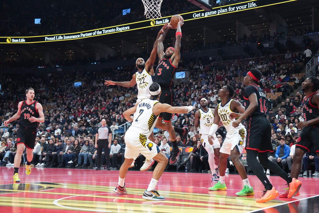 Toronto Raptors forward Brandon Ingram (3) scores as Indiana Pacers forward Isaiah Jackson (22) defends during first half NBA Cup basketball action in Toronto on Wednesday, Nov. 26, 2025. (Chris Young/The Canadian Press via AP)