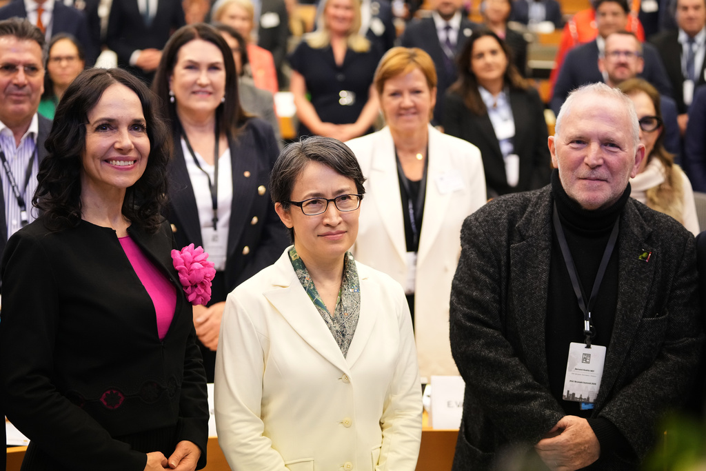 Taiwan's Vice President Bi-Khim Hsiao, center, poses after addressing an event at the European Parliament in Brussels, Friday, Nov. 7, 2025. (AP Photo/Virginia Mayo)
