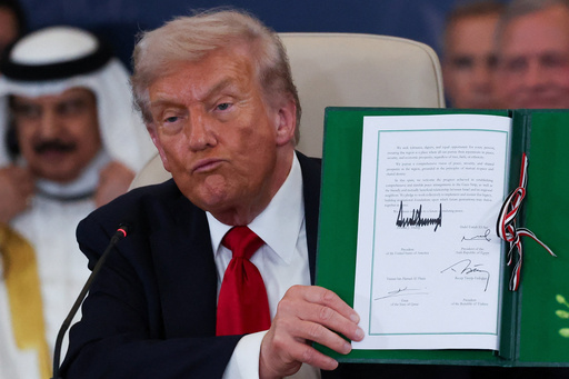 President Donald Trump holds a signed document during a summit to support ending the more than two-year Israel-Hamas war in Gaza after a breakthrough ceasefire deal, Monday, Oct. 13, 2025, in Sharm El Sheikh, Egypt. (Suzanne Plunkett/Pool via AP) President Donald Trump holds a signed document during a summit to support ending the more than two-year Israel-Hamas war in Gaza after a breakthrough ceasefire deal, Monday, Oct. 13, 2025, in Sharm El Sheikh, Egypt. (Suzanne Plunkett/Pool via AP)