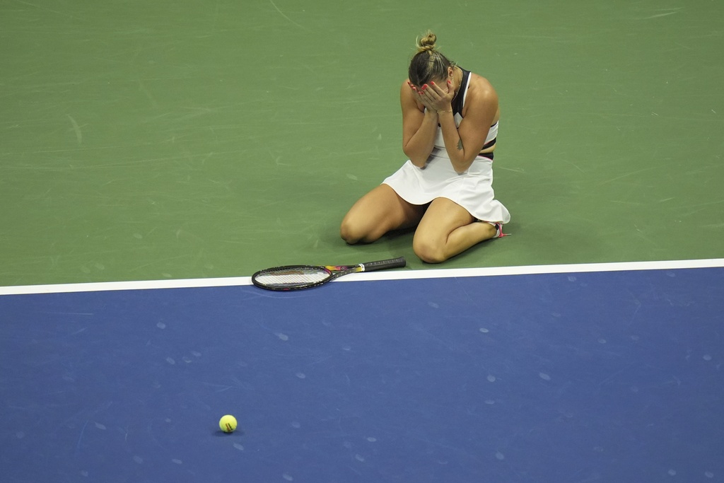 Aryna Sabalenka, of Belarus, reacts after defeating Amanda Anisimova, of the United States, during the women's finals of the U.S. Open tennis championships, Saturday, Sept. 6, 2025, in New York. (AP Photo/Seth Wenig)
