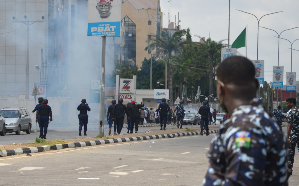 Police fire tear gas at protesters demanding the release of separatist leader Nnamdi Kanu in Abuja, Nigeria, Monday, Oct. 20, 2025. (AP Photo/Gbemiga Olamikan)