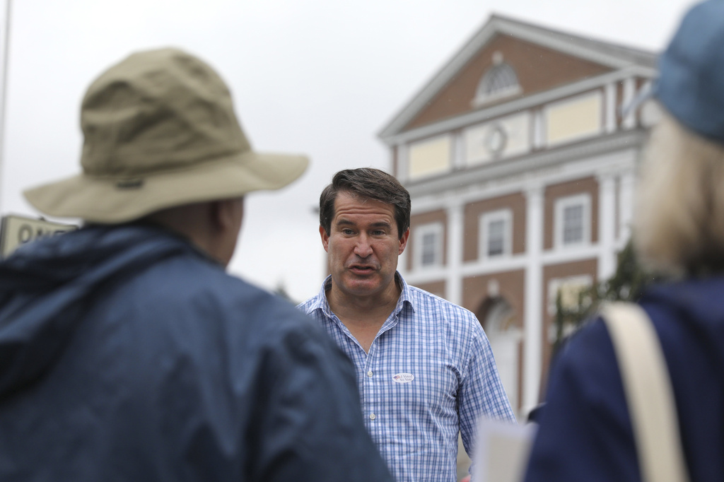 U.S. Rep. Seth Moulton campaigns outside Cary Hall, the town hall and polling place in Lexington, Mass., Tuesday, Sept. 1, 2026. (Lauren Feeney/Lexington Observer via AP)