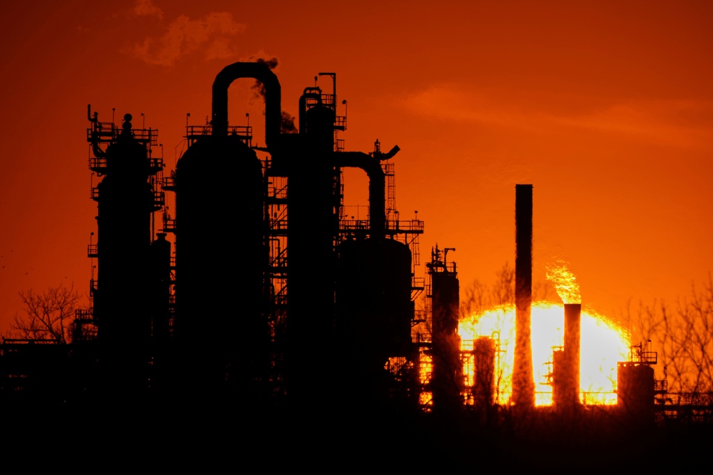 FILE - The HF Sinclair El Dorado oil refinery is silhouetted against the sky at sunset March 21, 2025, in El Dorado, Kan. (AP Photo/Charlie Riedel, File)