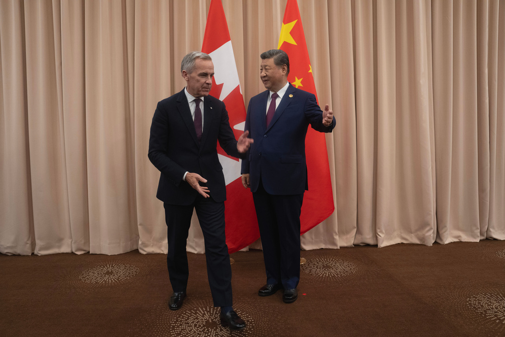 Canadian Prime Minister Mark Carney, left, meets Chinese President Xi Jinping at the start of a meeting in Gyeongju, South Korea Friday, Oct. 31, 2025. (Adrian Wyld/The Canadian Press via AP)