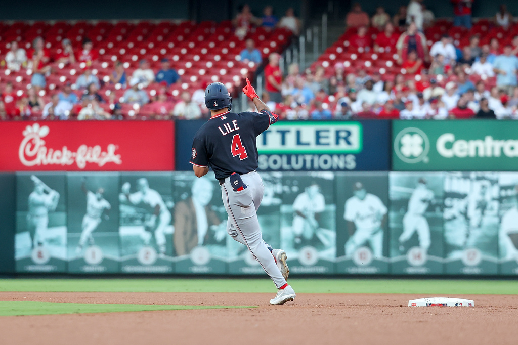 Washington Nationals' Daylen Lile celebrates as he runs the bases after hotting a two-run home run during the first inning of a baseball game against the St. Louis Cardinals Saturday, Sept. 19, 2026, in St. Louis. (AP Photo/Scott Kane)