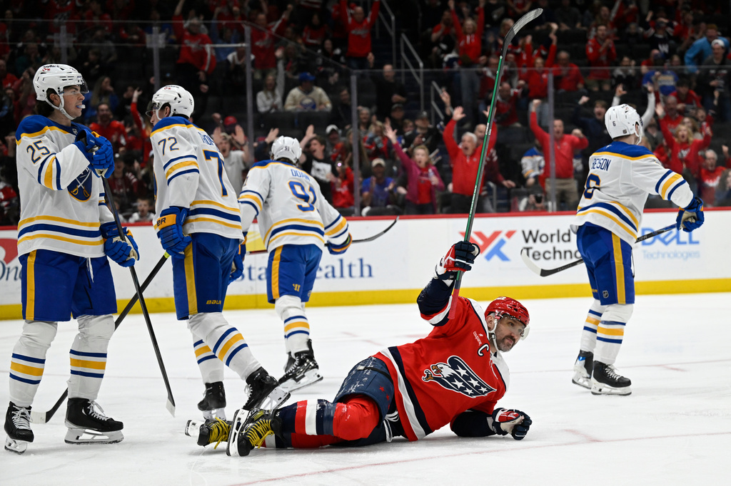 Washington Capitals left wing Alex Ovechkin celebrates Capitals Jakob Chychrun's goal during the first period of an NHL Hockey game against the Buffalo Sabres, Saturday, April 4, 2026, in Washington. (AP Photo/John McDonnell)