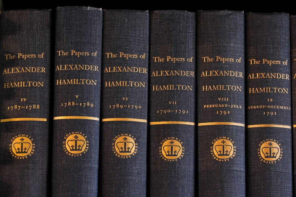 Bound copies of Alexander Hamilton's papers are displayed on a shelf at the Boston Athenaeum, a private library, Thursday, Oct. 9, 2025, in Boston. (AP Photo/Charles Krupa)