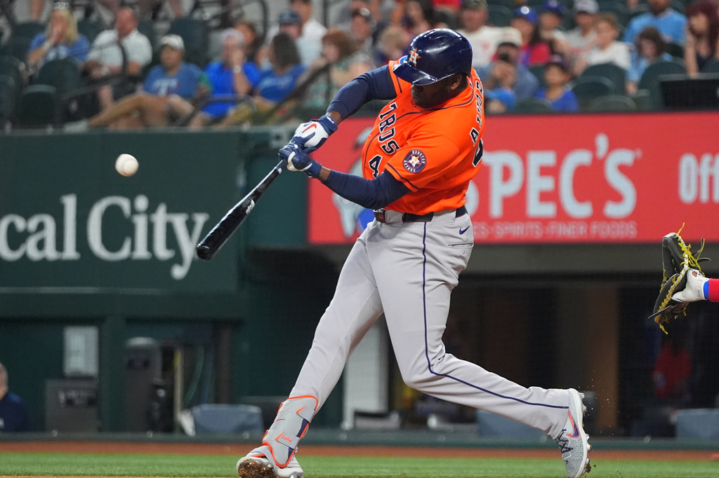 Houston Astros designated hitter Yordan Alvarez hits a home run against the Texas Rangers during the first inning of a baseball game, Saturday, July 11, 2026, in Arlington, Texas. (AP Photo/LM Otero)