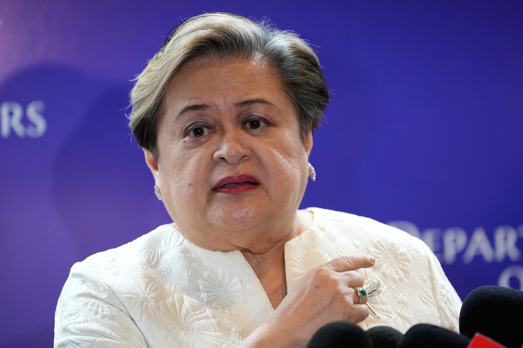 Philippine Foreign Secretary Maria Theresa Lazaro answers questions from reporters as they mark the 10th anniversary of a 2016 arbitration ruling which invalidated China's expansive claims in the disputed South China Sea during a conference in Manila, Philippines on Friday, July 10, 2026. (AP Photo/Aaron Favila)