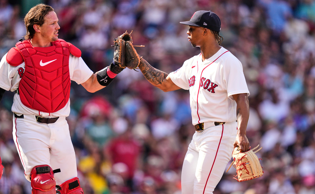 Boston Red Sox starting pitcher Brayan Bello, right, is congratulated by catcher Adley Rutschman after his scoreless outing following the fifth inning of a baseball game against the Los Angeles Angels, Monday, Sept. 7, 2026, in Boston. (AP Photo/Charles Krupa)