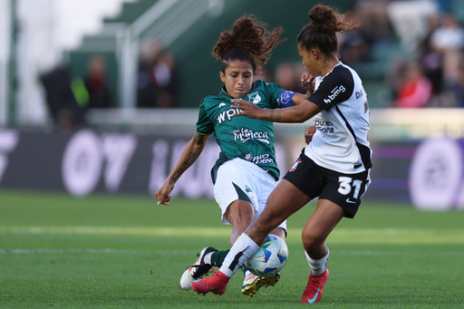 Dayana Rodriguez (31) of Brazil's Corinthians and Paola Garcia of Colombia's Deportivo Cali battle for the ball during the Women’s Copa Libertadores final soccer match in Buenos Aires, Argentina, Saturday, Oct. 18, 2025. (AP Photo/Luciano Gonzalez) Dayana Rodriguez (31) of Brazil's Corinthians and Paola Garcia of Colombia's Deportivo Cali battle for the ball during the Women’s Copa Libertadores final soccer match in Buenos Aires, Argentina, Saturday, Oct. 18, 2025. (AP Photo/Luciano Gonzalez)