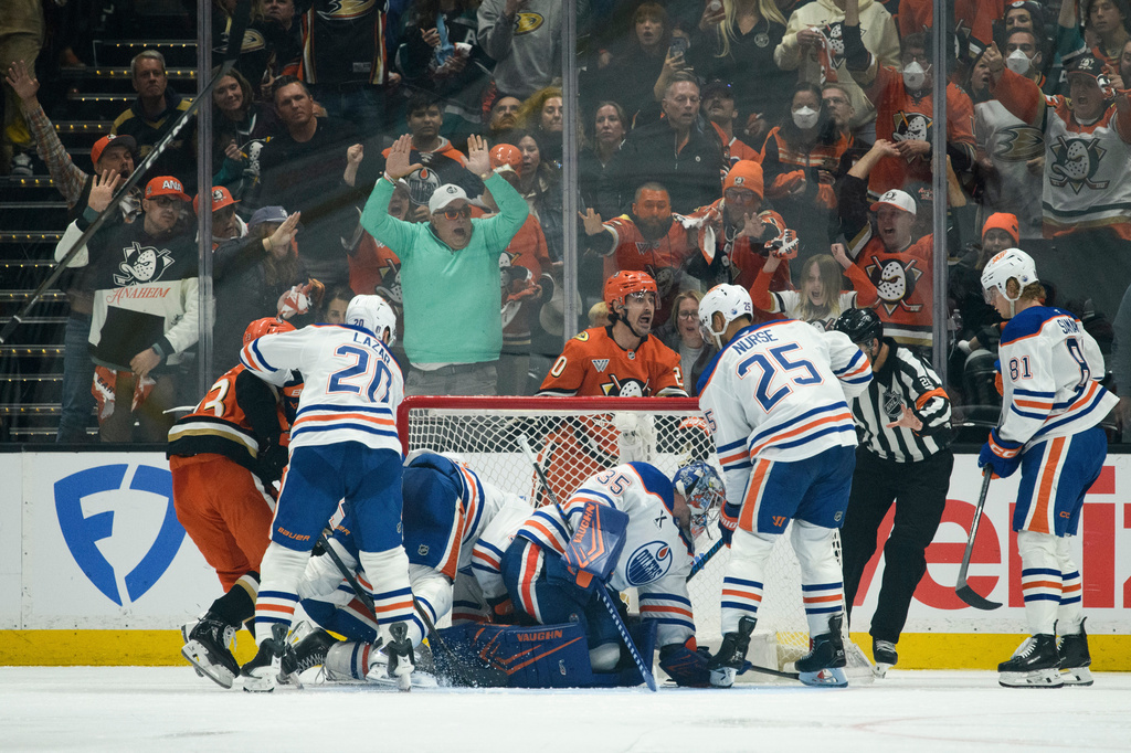 Anaheim Ducks left wing Chris Kreider, top center, reacts on the game-winning, overtime goal by center Ryan Poehling, not shown, in Game 4 in the first round of an NHL hockey Stanley Cup playoff series against the Edmonton Oilers, Sunday, April 26, 2026, in Anaheim, Calif. (AP Photo/Kyusung Gong)