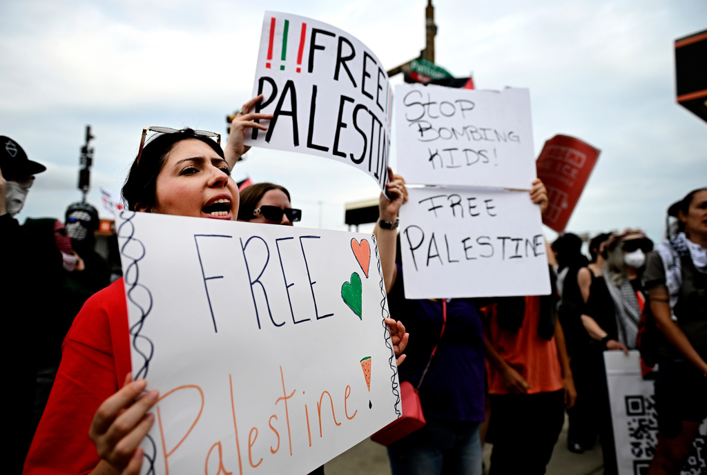 Pro-Palestinian demonstrators hold signs during a "Free Palestine" protest before an Ed Sheeran concert in Philadelphia, Saturday, Sept. 19, 2026. (AP Photo/Allie Ippolito)