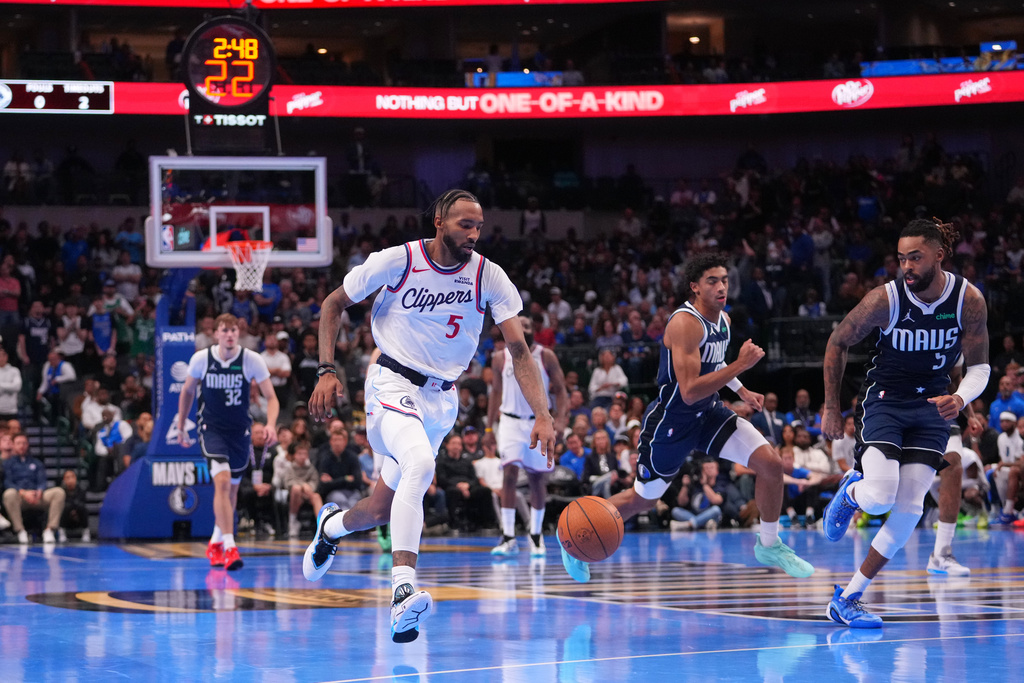 Los Angeles Clippers forward Derrick Jones Jr. (5) dribbles the ball on a breakaway against the Dallas Mavericks during double overtime of an NBA Cup basketball game Friday, Nov. 14, 2025, in Dallas. (AP Photo/Julio Cortez)