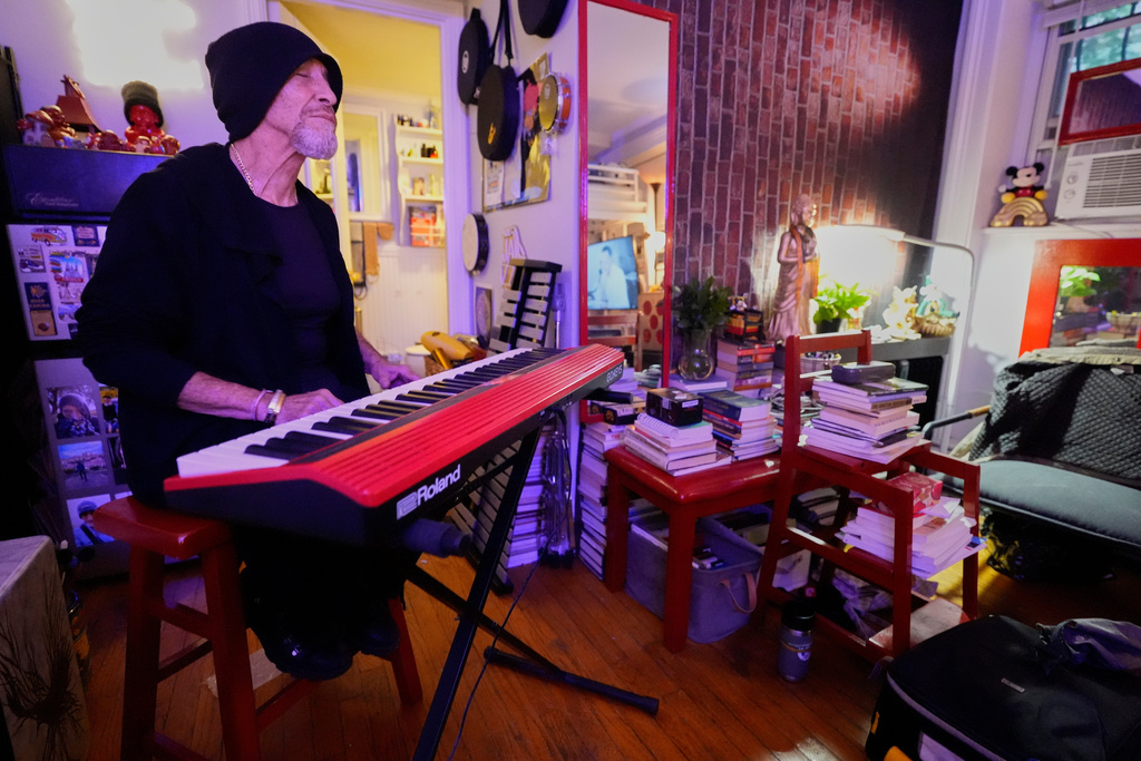 Miguel Laboy plays the keyboard after smoking cannabis, Oct. 3, 2025, in Brookline, Mass. (AP Photo/Robert F. Bukaty)