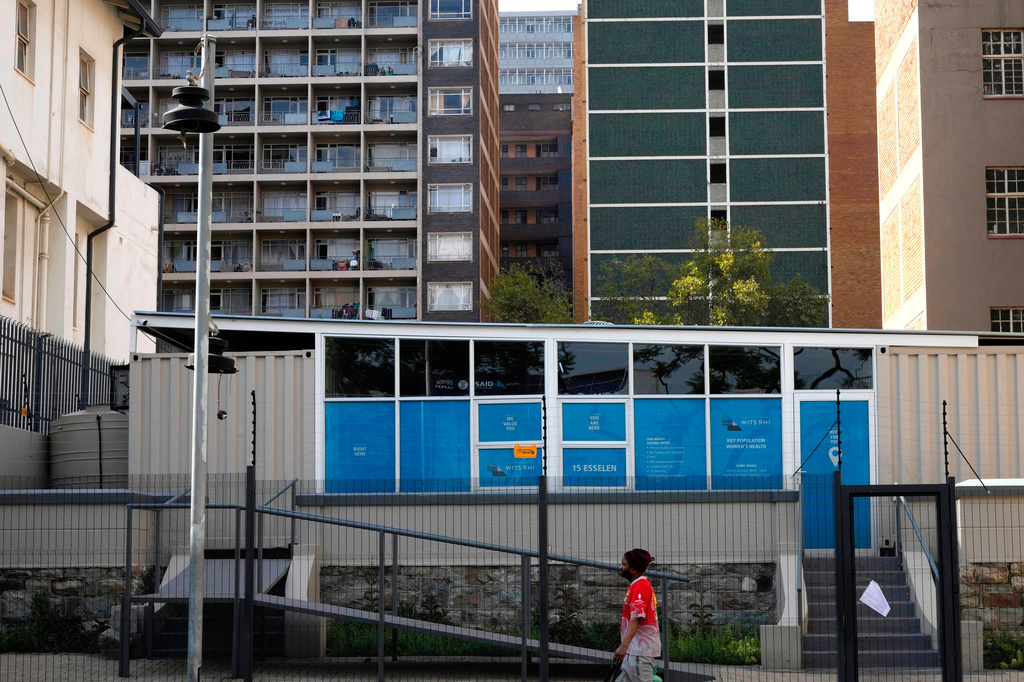 FILE - A man walks past a closed clinic run by WITS Reproductive Health Institute (RHI) as a sign on the gate reads "USAID has served the WITS RHI Key Populations Programme a notice to pause programme implementation. As of Tuesday, 28 January, we are unable to provide services until further notice." in Johannesburg, South Africa, Feb. 27, 2025. (AP Photo/Themba Hadebe, File)