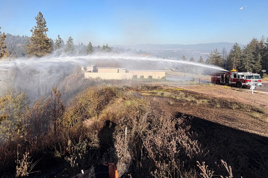 Fire crews battle the Upriver Fire on Tuesday, June 16, 2026 east of Spokane, Wash. (Spokane Valley Fire Department via AP)