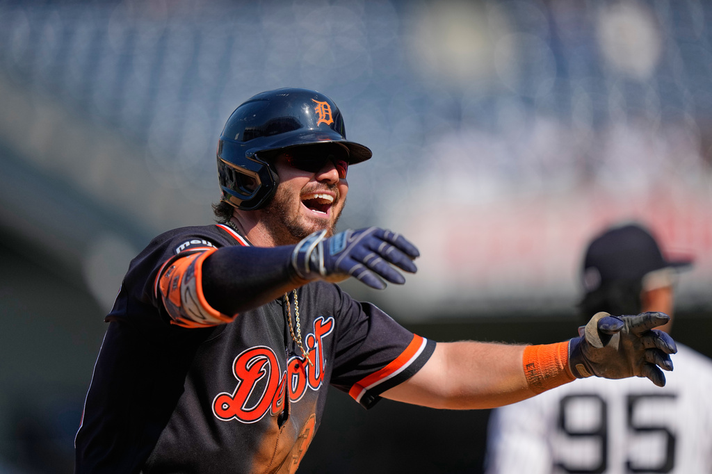 Detroit Tigers' Zach McKinstry gerstures to teammates after advancing to third base on a throwing error by New York Yankees' Ali Sánchez during the 11th inning of a baseball game Wednesday, July 1, 2026, in New York. (AP Photo/Frank Franklin II)