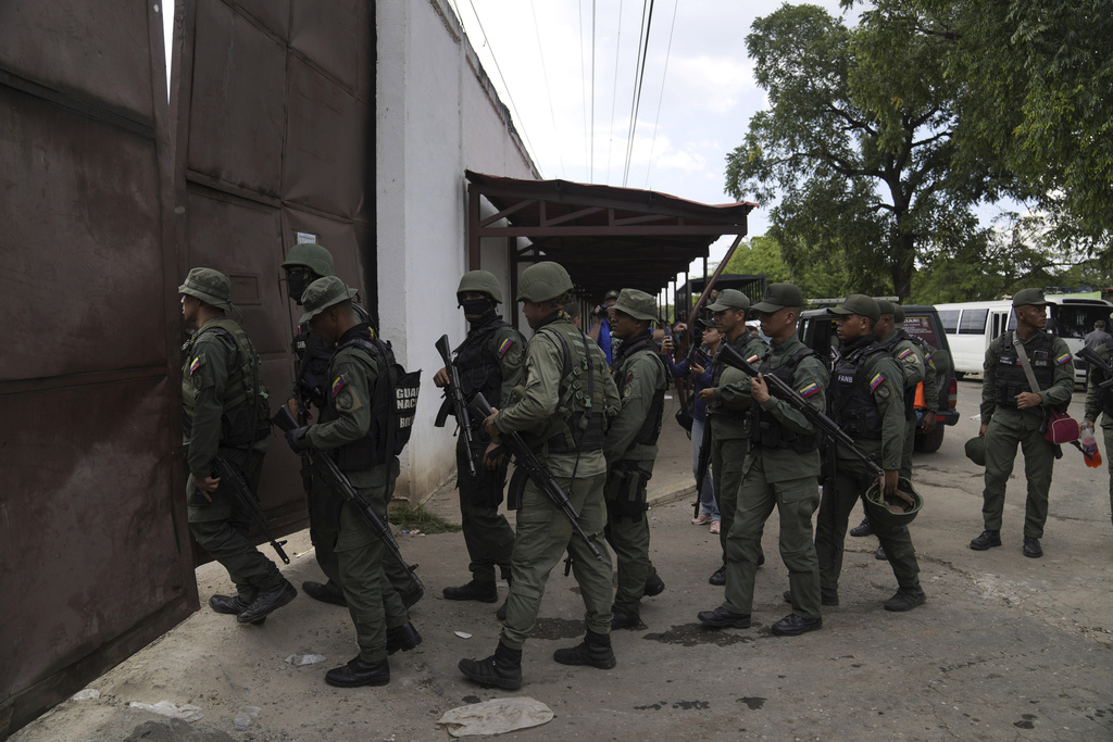 FILE - Soldiers raid the Tocorón Penitentiary Center, where the Tren de Aragua gang originated, in Tocorón, Venezuela, Sept. 20, 2023. (AP Photo/Ariana Cubillos, File)