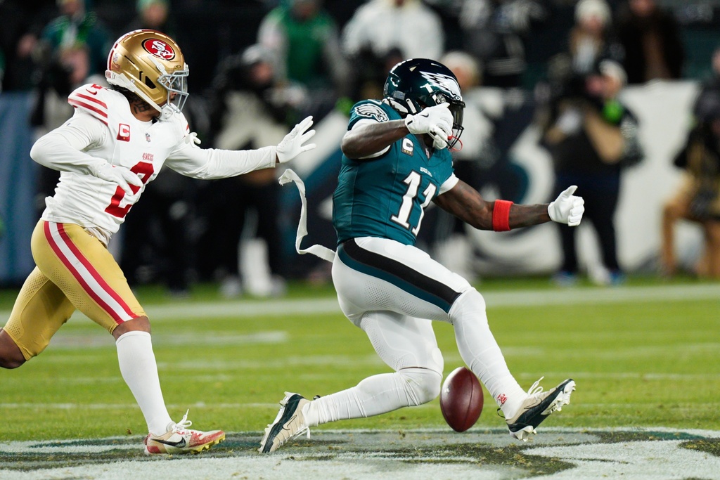 Philadelphia Eagles wide receiver A.J. Brown (11) is unable to make the catch as San Francisco 49ers cornerback Deommodore Lenoir (2) defends during the second half of an NFL wild-card playoff football game Sunday, Jan. 11, 2026, in Philadelphia. (AP Photo/Chris Szagola)