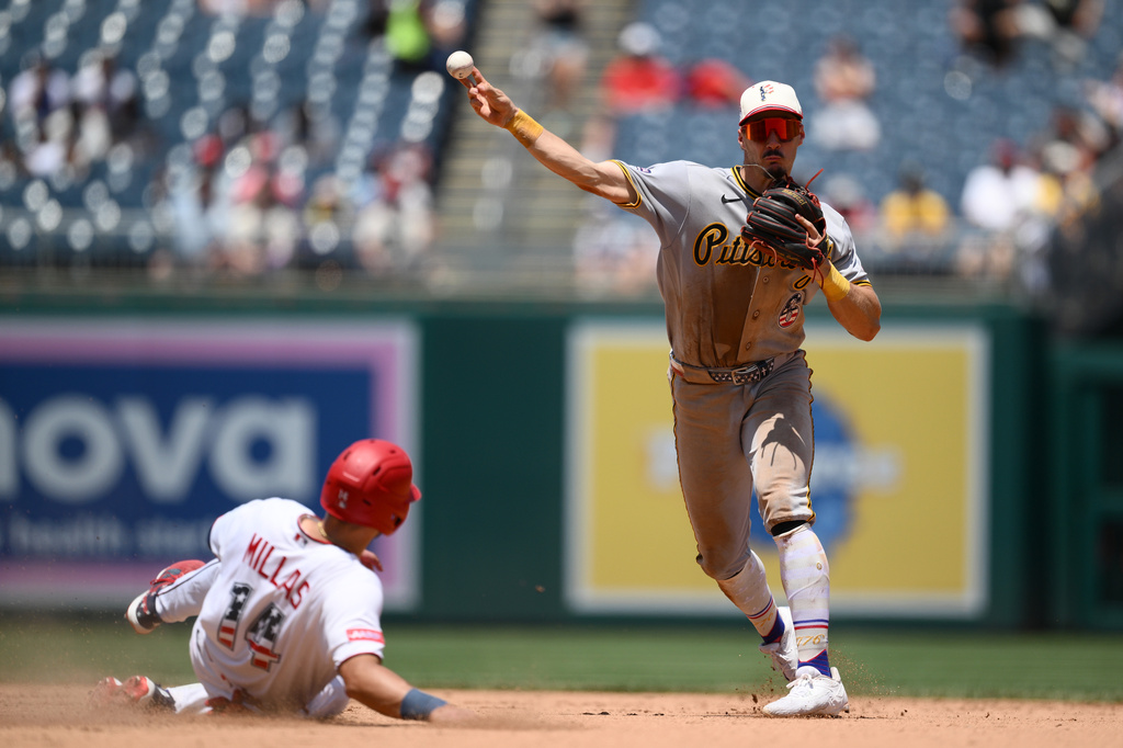 Washington Nationals' Drew Millas is out at second base as Pittsburgh Pirates shortstop Konnor Griffin throws to first base to put out Nationals' Nasim Nunez during the seventh inning of a baseball game, Saturday, July 4, 2026, in Washington. (AP Photo/Nick Wass)
