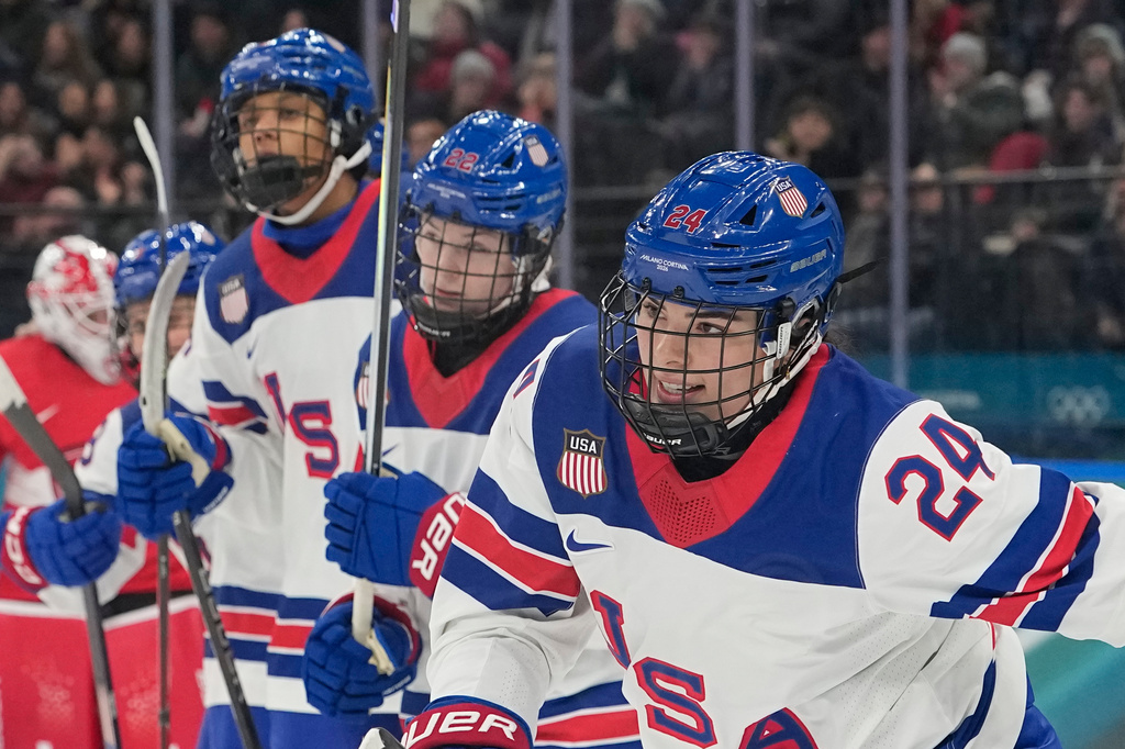 United States' Joy Dunne, right, celebrates after scoring her side's second goal during a preliminary round match of women's ice hockey between Switzerland and United States at the 2026 Winter Olympics, in Milan, Italy, Monday, Feb. 9, 2026. (AP Photo/Hassan Ammar)