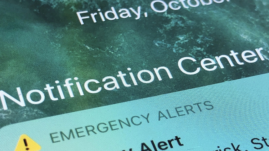 FILE - An emergency alert is displayed on a cellphone, Oct. 30, 2020, in Rio Rancho, N.M. (AP Photo/Susan Montoya Bryan, File)