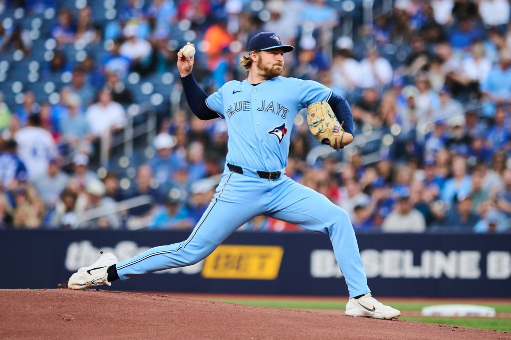Toronto Blue Jays pitcher Spencer Miles works against the Kansas City Royals during the first inning of a baseball game in Toronto, Wednesday, Aug. 26, 2026. (Sammy Kogan/The Canadian Press via AP)