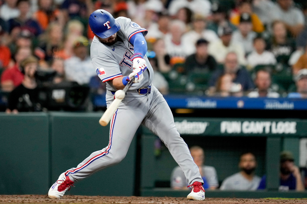 Texas Rangers' Jake Burger hits a two-run home run against the Houston Astros during the fifth inning of a baseball game, Sunday, May 17, 2026, in Houston. (AP Photo/Eric Christian Smith)