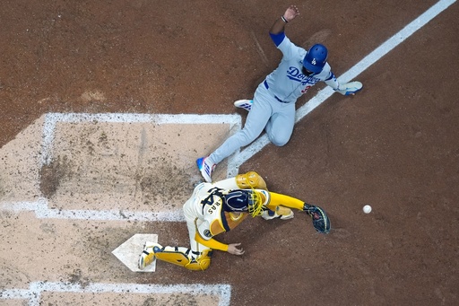 Los Angeles Dodgers' Teoscar Hernández is out at home as Milwaukee Brewers catcher William Contreras takes the throw during the fourth inning of Game 1 of baseball's National League Championship Series Monday, Oct. 13, 2025, in Milwaukee. (AP Photo/Morry Gash) Los Angeles Dodgers' Teoscar Hernández is out at home as Milwaukee Brewers catcher William Contreras takes the throw during the fourth inning of Game 1 of baseball's National League Championship Series Monday, Oct. 13, 2025, in Milwaukee. (AP Photo/Morry Gash)