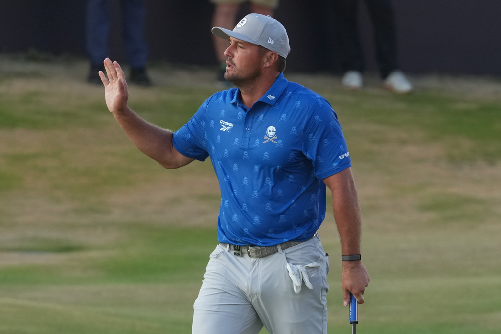 Bryson DeChambeau of the United States acknowledges the crowd after making a birdie putt to conclude his second round on the 18th green during the second day of the British Open Golf championships at Royal Birkdale golf club, in Southport, England, Friday, July 17, 2026. (AP Photo/Jon Super)