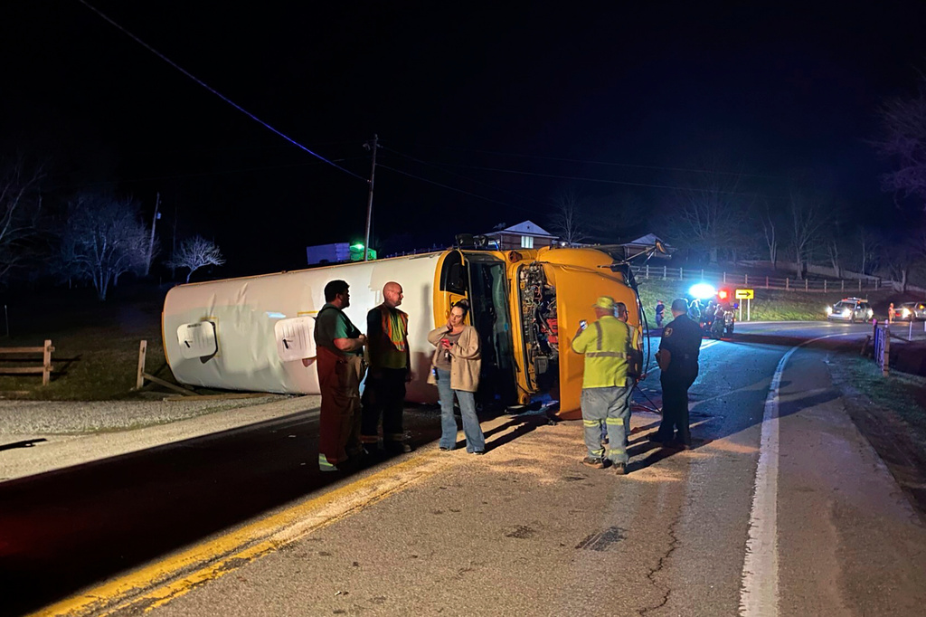 FILE - Emergency personnel respond to the scene of a bus crash, March 4, 2024, on West Virginia Route 16 in Calhoun County, W.Va. (WCHS TV via AP, File)