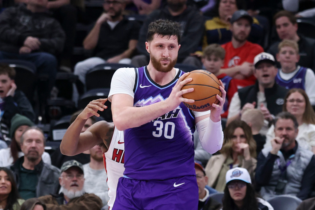 Utah Jazz center Jusuf Nurkic (30) rebounds the ball to complete a triple double against the Miami Heat during the second half of an NBA basketball game, Saturday, Jan. 24, 2026, in Salt Lake City. (AP Photo/Rob Gray)