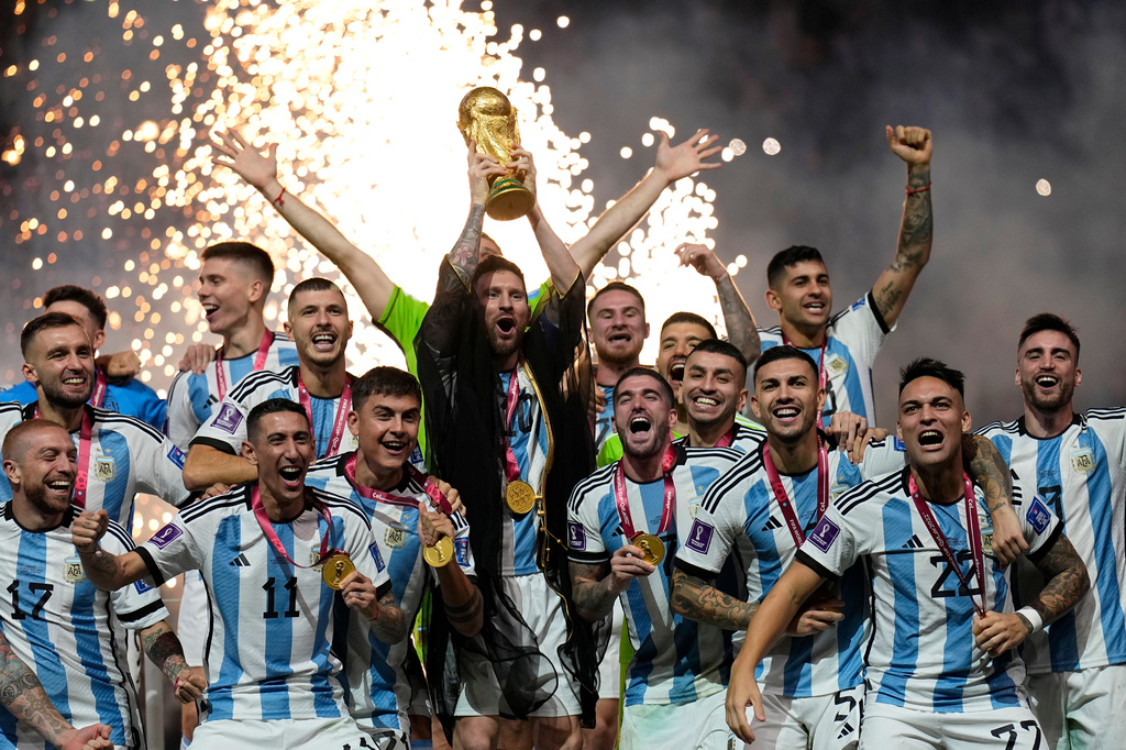 FILE - Argentina's Lionel Messi lifts the trophy after winning the World Cup final soccer match between Argentina and France in Lusail, Qatar, Dec. 18, 2022. Argentina won 4-2 in a penalty shootout after the match ended tied 3-3. (AP Photo/Martin Meissner, File)