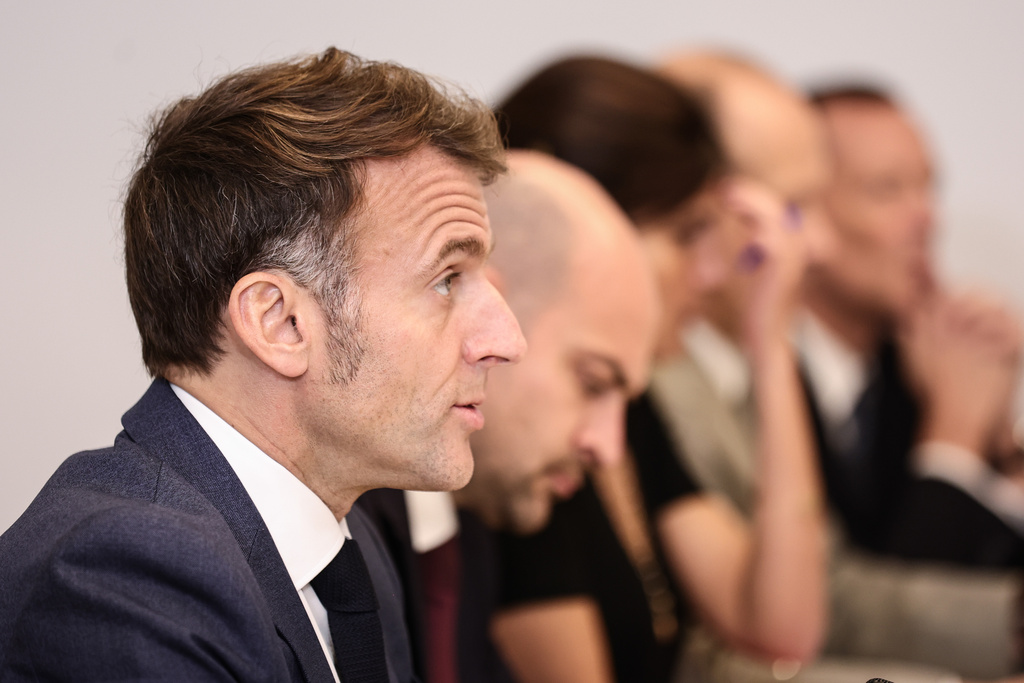 French President Emmanuel Macron, left, attends a video conference of the 'Coalition of the Willing' on Ukraine at the Elysee Palace in Paris, France, Tuesday, Nov. 25, 2025. (Teresa Saurez, Pool Photo via AP)