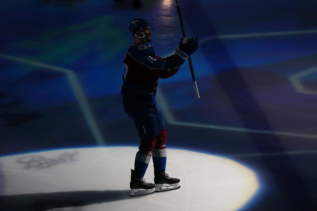 Colorado Avalanche center Nicolas Roy (10) waves to the crowd while being recognized as the player of the game after scoring the game winning goal against the Los Angeles Kings in overtime of Game 2 in the first round of the NHL hockey Stanley Cup playoffs, Tuesday, April 21, 2026, in Denver. (AP Photo/Jack Dempsey)