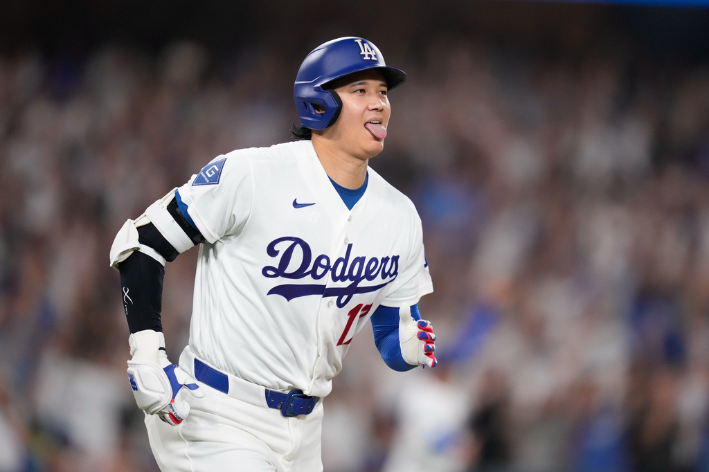 Los Angeles Dodgers' Shohei Ohtani heads to first for a two-run home run during the fifth inning of a baseball game against the Boston Red Sox, Friday, July 31, 2026, in Los Angeles. (AP Photo/Mark J. Terrill)