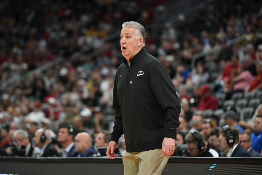 Purdue head coach Matt Painter is seen on the sidelines during the first half in the second round of the NCAA college basketball tournament against Miami, Sunday, March 22, 2026, in St. Louis. (AP Photo/Ali Overstreet)