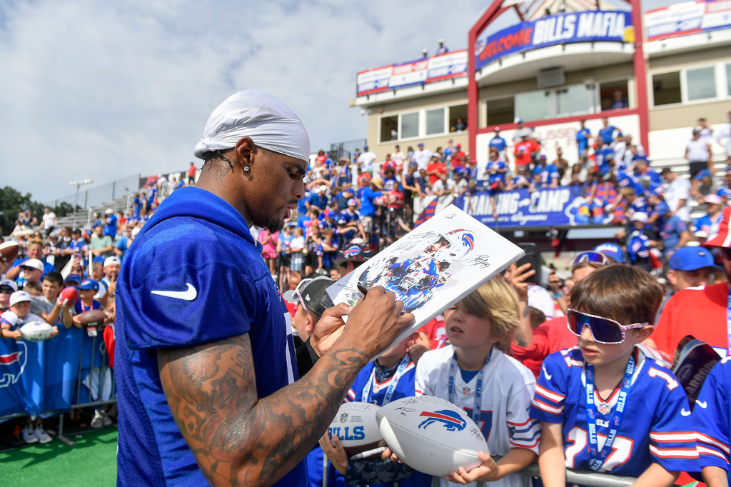 Buffalo Bills wide receiver Keon Coleman (0) signs autographs after practice at the team's NFL football training camp Saturday, Aug. 1, 2026, in Pittsford, N.Y. (AP Photo/Adrian Kraus)