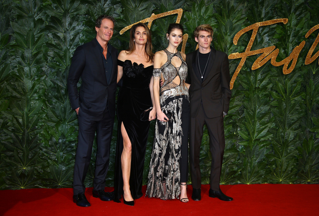 FILE - Businessman Rande Gerber, from left, models Cindy Crawford, Kaia Gerber and Presley Walker Gerber pose in central London, Monday, Dec. 10, 2018. (Photo by Joel C Ryan/Invision/AP, File)