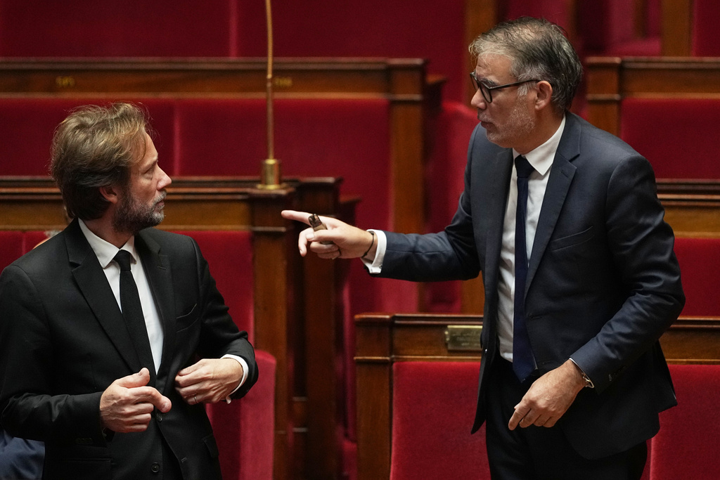 French socialist party general secretary Olivier Faure, right, talks with the president of the Socialist group in the National Assembly Boris Vallaud before a no-confidence vote, Thursday, Oct. 16, 2025 at the National Assembly in Paris. (AP Photo/Thibault Camus)