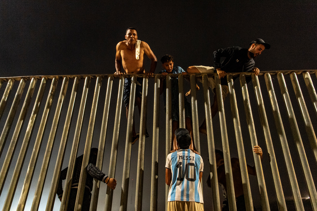 Migrants try to cross from Morocco into the Spanish enclave of Ceuta, Friday, July 31, 2026. (AP Photo/Antonio Sempere)
