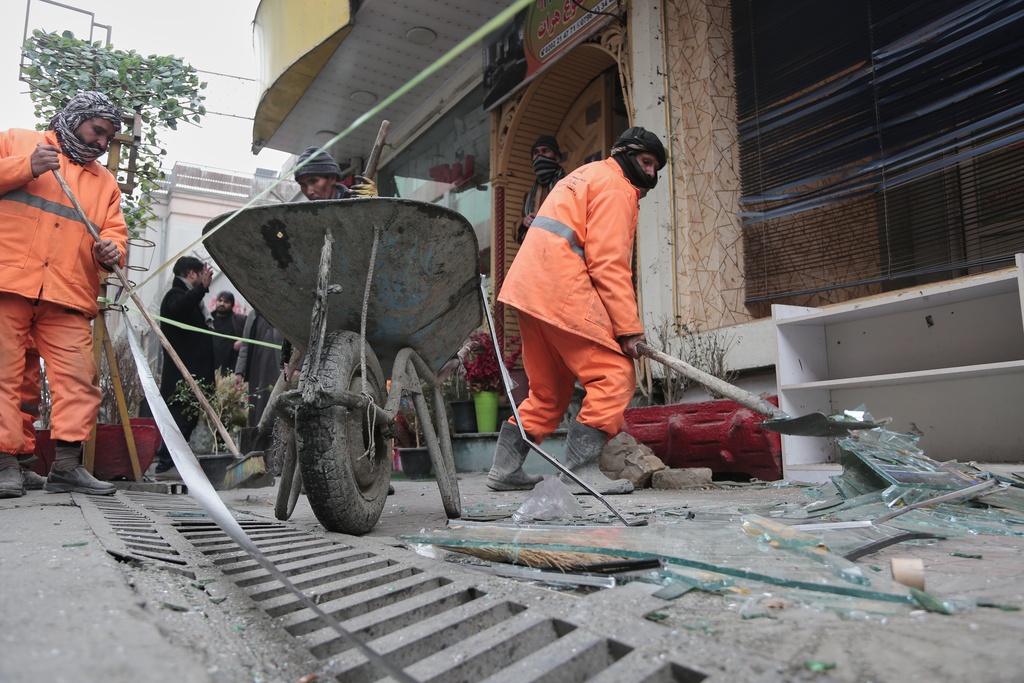 Workers clean the scene after an explosion at a Chinese restaurant killed at least seven people, including a Chinese national, a day earlier in Kabul, Afghanistan, Tuesday, Jan. 20, 2026. (AP Photo/Siddiqullah Alizai)